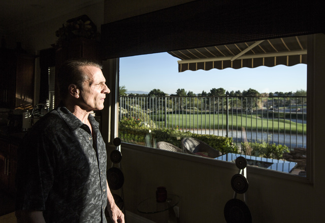 Eddie Canonic views the Badlands Golf Course from his kitchen window in his townhouse at Tudor Park on Thursday, Oct. 10, 2016. Canonic is concerned that he will loose his view if the controversia ...