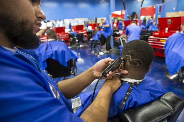 Barber student Christian Diaz freestyles a design in the hair of customer Tristan Clay, 14, during class at the Masterpiece Barber College in Las Vegas, Thursday, Oct. 20, 2016. (Richard Brian/Las ...