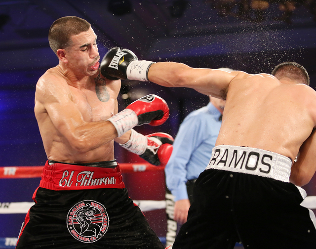 Casey Ramos, right, of Austin, Tex., throws a blow to Andy Vences, of San Jose, during a super featherweight boxing bout at T.I. hotel-casino Friday, Nov. 4, 2016, in Las Vegas. Vences won by unan ...