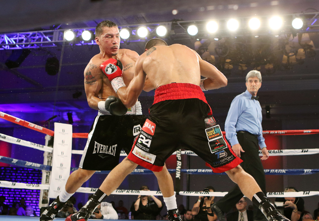 Andy Vences, right, of San Jose, makes contact with Casey Ramos, of Austin, Tex., during a super featherweight boxing bout at T.I. hotel-casino Friday, Nov. 4, 2016, in Las Vegas. Vences won by un ...
