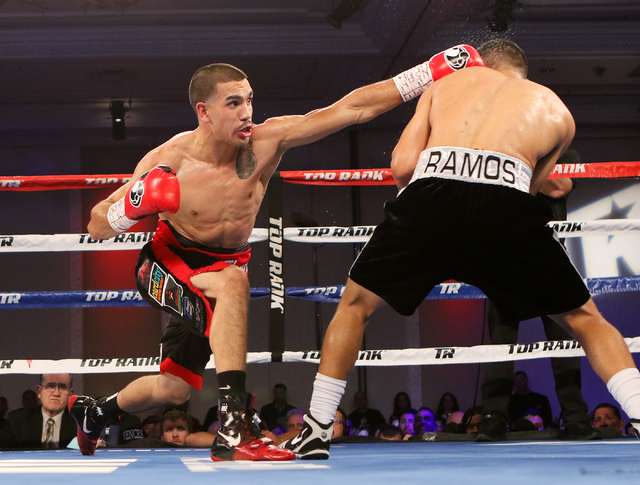 Andy Vences, left, of San Jose, makes contact with Casey Ramos, of Austin, Tex., during a super featherweight boxing bout at T.I. hotel-casino Friday, Nov. 4, 2016, in Las Vegas. Vences won by una ...