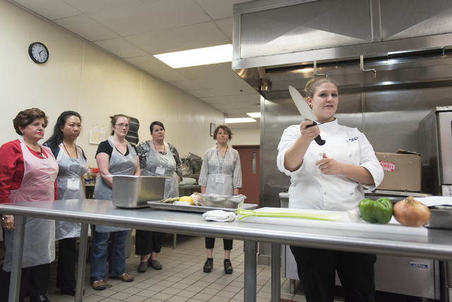 Kerri Dotson, chef and registered dietitian with the Goldring Center for Culinary Medicine at Tulane University, demonstrates proper cutting technique during a cooking class for the Primary Care C ...