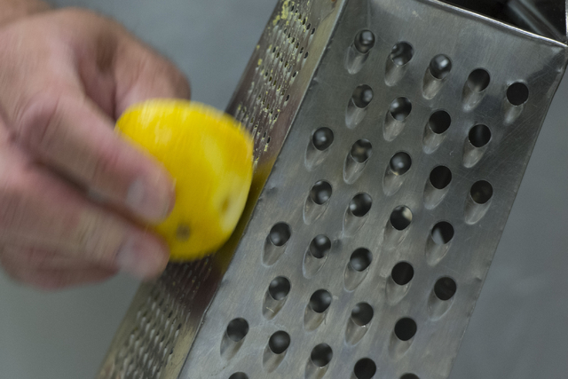 Mike Deneff zests a lemon during a cooking class for the Primary Care Cardiometabolic Risk Summit at the Culinary Academy of Las Vegas, Sunday, Oct. 16, 2016. The cooking class is called " ...