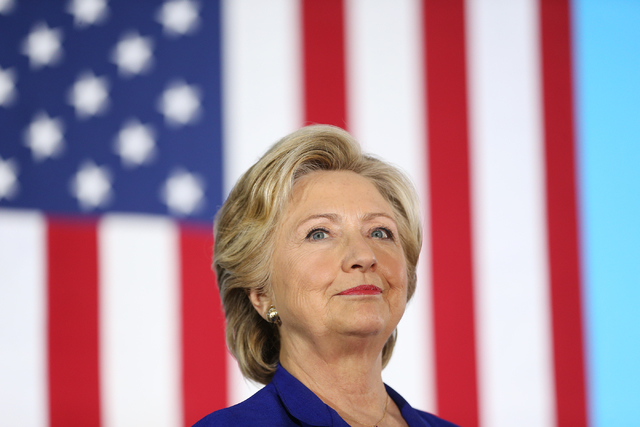 Democratic presidential nominee Hillary Clinton stands on stage waiting to speak for a campaign rally at the Plumbers & Pipefitters Training Center on Wednesday, Nov. 2, 2016, in Las Vegas. Er ...