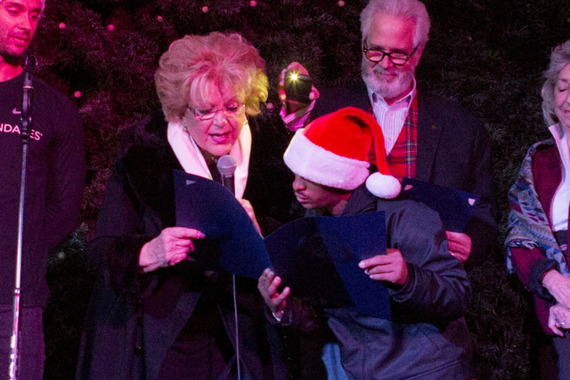 Las Vegas Mayor Carolyn Goodman, left, OVIP Reggie, center, and President and CEO of Opportunity Village, Bob Brown, introduce the 25th tree lighting ceremony at Opportunity Village, Friday, Nov.  ...