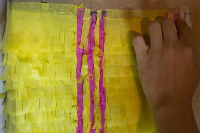 Applying traditional techniques, artist Justin Favela glues strips of hand-cut tissue paper onto cardboard while working in his studio at the Juhl in downtown Las Vegas. Richard Brian/Las Vegas Re ...
