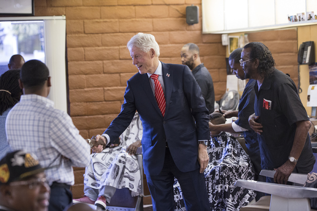 Former President Bill Clinton shakes hands with supporters at Hair Unlimited on Thursday, Nov. 3, 2016, in Las Vegas. President Clinton was in Las Vegas for a rally at Cox Pavilion for his wife, D ...