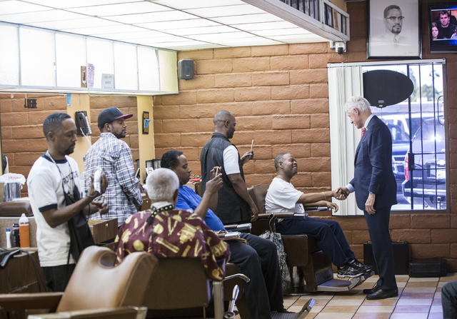 Former President Bill Clinton shakes hands with supporters at Hair Unlimited on Thursday, Nov. 3, 2016, in Las Vegas. President Clinton was in Las Vegas for a rally at Cox Pavilion for his wife, D ...