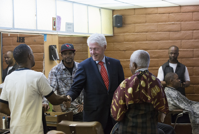 Former President Bill Clinton shakes hands with supporters at Hair Unlimited on Thursday, Nov. 3, 2016, in Las Vegas. President Clinton was in Las Vegas for a rally at Cox Pavilion for his wife, D ...