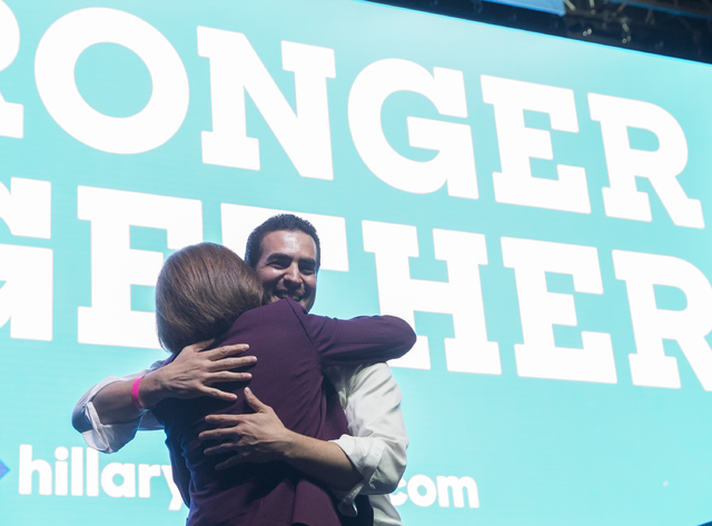 U.S. Senate candidate Catherine Cortez Masto, left, hugs State Senator Ruben Kihuen, D-Nevada, at a rally for Democratic presidential nominee Hillary Clinton at Cox Pavilion on Thursday, Nov. 3, 2 ...