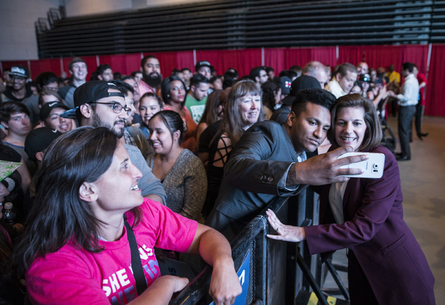 U.S. Senate candidate Catherine Cortez Masto takes a selfie with supporters at a rally for Democratic presidential nominee Hillary Clinton at Cox Pavilion on Thursday, Nov. 3, 2016, at UNLV, in La ...