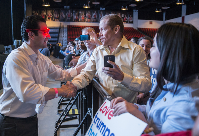 State Senator Ruben Kihuen, D-Nevada, left, shakes hands with Gig Schmidt at a rally for Democratic presidential nominee Hillary Clinton at Cox Pavilion on Thursday, Nov. 3, 2016, at UNLV, in Las ...