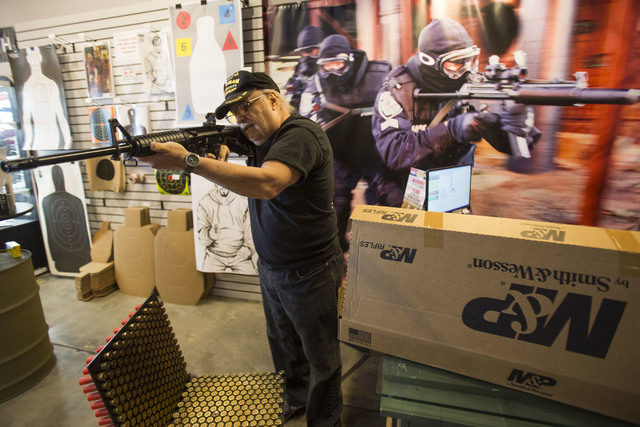 Las Vegas resident Al Wooten, 67, tries out his new Smith & Wesson rifle at Westside Armory, a gun and ammo store, located at 7345 S. Durango Drive in Las Vegas on Tuesday, Oct. 18, 2016. Rich ...