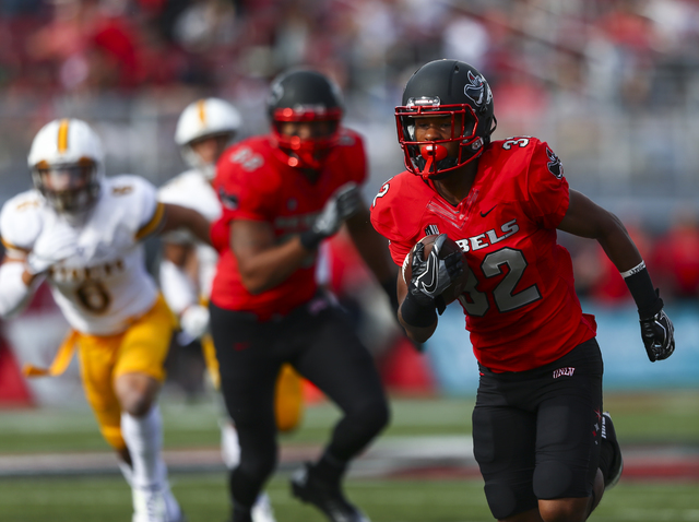 UNLV defensive back Jericho Flowers (32) runs the ball to score a touchdown during a football game against Wyoming at Sam Boyd Stadium in Las Vegas on Saturday, Nov. 12, 2016. (Chase Stevens/Las V ...
