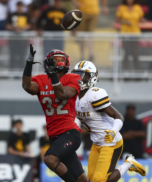 UNLV defensive back Jericho Flowers (32) receives a pass in the end zone to score a touchdown during a football game against Wyoming at Sam Boyd Stadium in Las Vegas on Saturday, Nov. 12, 2016. UN ...