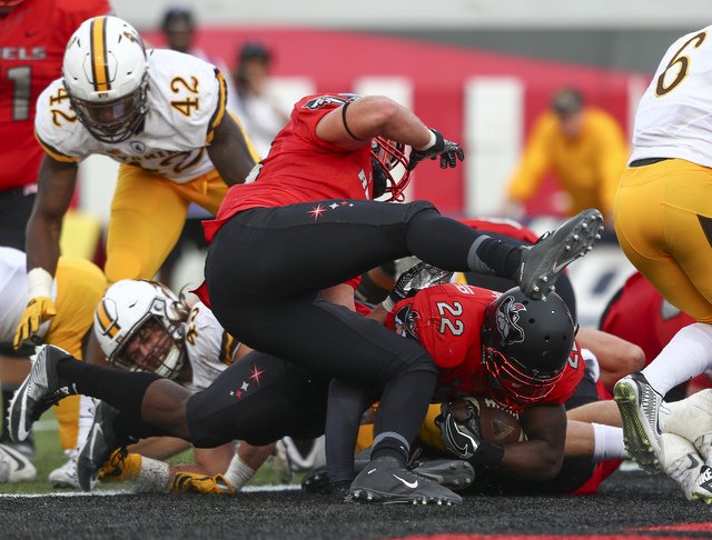 UNLV running back David Greene (22) makes it into the end zone to score during a football game against Wyoming at Sam Boyd Stadium in Las Vegas on Saturday, Nov. 12, 2016. UNLV defeated Wyoming 69 ...