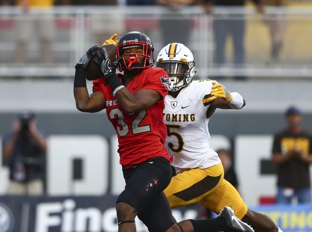 UNLV defensive back Jericho Flowers (32) receives a pass in the end zone to score a touchdown during a football game against Wyoming at Sam Boyd Stadium in Las Vegas on Saturday, Nov. 12, 2016. UN ...