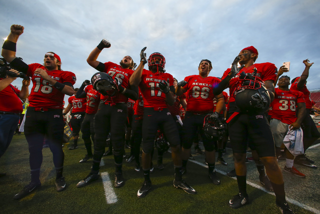 UNLV players celebrate after defeating Wyoming 69-66 in a triple overtime football game at Sam Boyd Stadium in Las Vegas on Saturday, Nov. 12, 2016. Chase Stevens/Las Vegas Review-Journal Follow @ ...