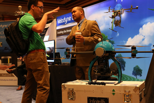 Andrew Stewart (left) speaks with Vitad Pradith with Hypack, about the Nexus 800 drone during the Commercial UAV Expo at the MGM Grand in Las Vegas Tuesday, Nov. 1, 2016. "It operates as ...