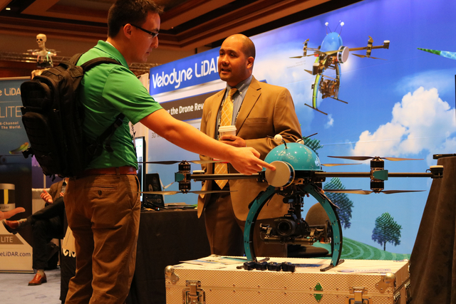 Andrew Stewart (left) speaks with Vitad Pradith with Hypack, about the Nexus 800 drone during the Commercial UAV Expo at the MGM Grand in Las Vegas Tuesday, Nov. 1, 2016.  &quot;It operates as ...