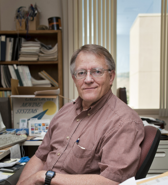 Climatologist Kelly Redmond poses in his Western Regional Climate Center office at the Desert Research Institute in Reno. Redmond died Thursday at age 64. (Desert Research Institute)