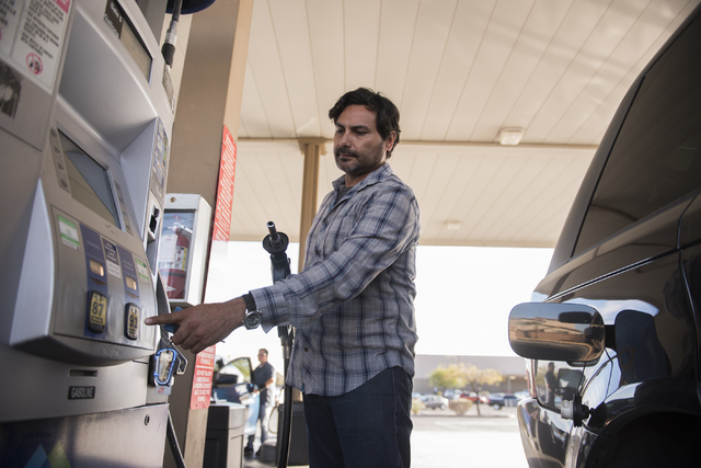 Guillermo Rangel prepares to pump gas at the Sam's Club fuel station in Las Vegas on Wednesday, Oct. 26, 2016. (Martin S. Fuentes/Las Vegas Review-Journal)