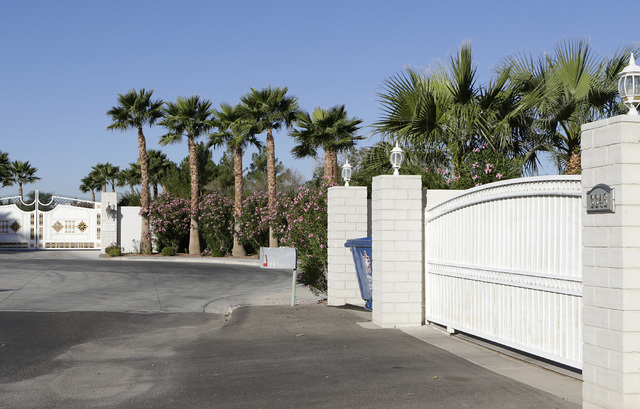 A gated house, right, at 3346 Smoke Tree Lane near Sunset Park in Las Vegas is seen Monday, Nov 7, 2016. Residents in the area say that peacocks routinely swarm the area causing a nuisance. (Bizua ...