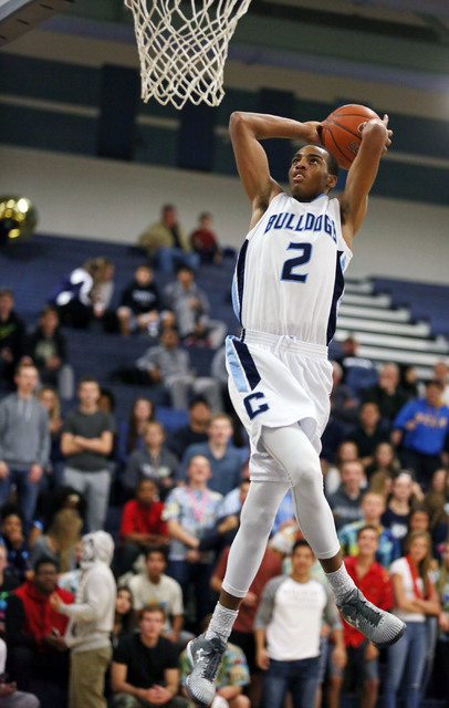 Centennial’s Troy Brown goes up for a dunk on Friday against Durango. Brown had 16 points as Centennial won, 69-58. (Ronda Churchill/Las Vegas Review-Journal)