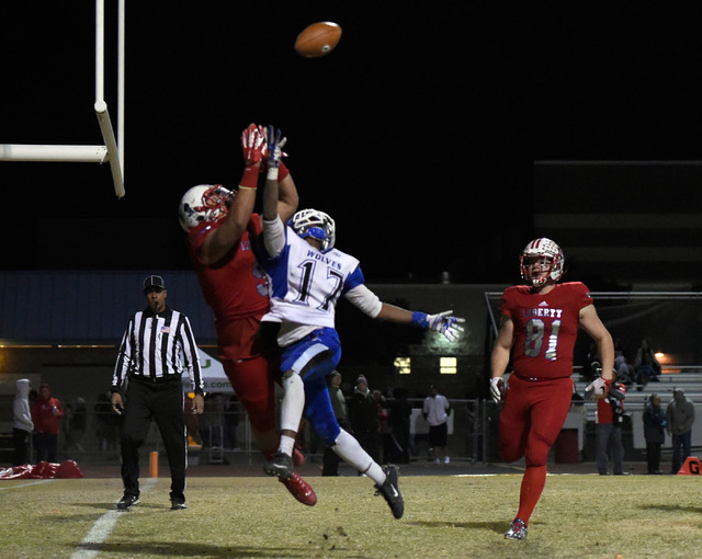 Basic's Quison Owens (17) defends Liberty's Crishaun Lappin during a high school football game at Liberty High School Friday, Nov. 18, 2016, in Henderson. David Becker/Las Vegas Review-Journal Fol ...