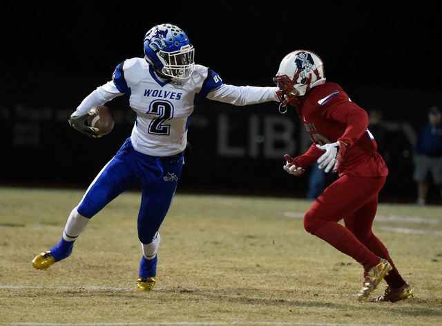 Basic's De'Shawn Eagles (2) stiff arms Liberty's Dominique Turner during a high school football game at Liberty High School Friday, Nov. 18, 2016, in Henderson. David Becker/Las Vegas Review-Journ ...