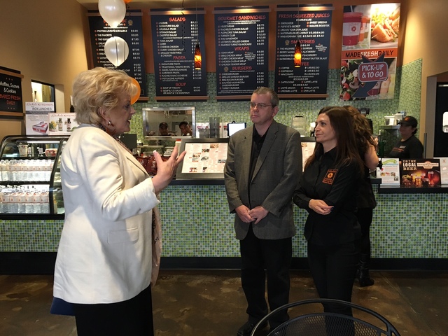 Debbie Roxarzade, far right and founder of Rachel's Kitchen, and franchise owner John Henderson, center, talk Sept. 26 with Las Vegas Mayor Caroline Goodman, who recognized Roxarzade for being in  ...