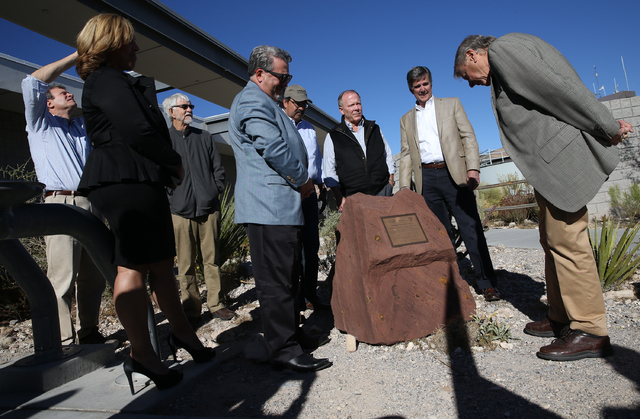 Joel Laub, right, chairman of the board of trustees for the Nature Conservancy, reads the inscription on the new monument celebrating the Nature Conservancy, Bureau of Land Management and Summerli ...