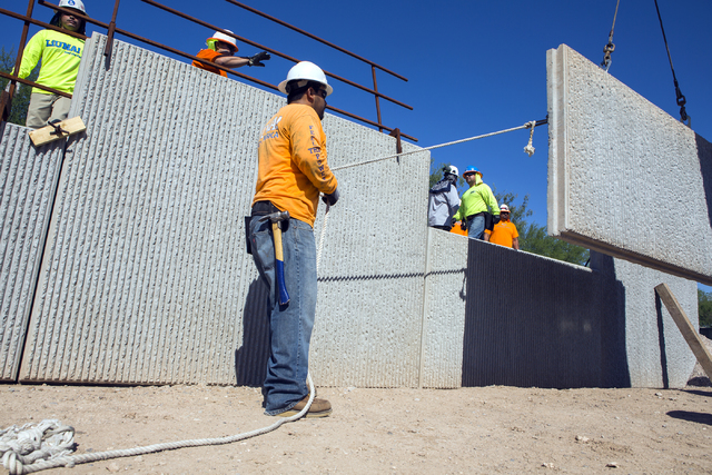 Humberto Sarmiento guides a retaining wall during training class at Laborers Local 872 training center on Monday, Aug. 29, 2016. Nevada Department of Transportation, Kiewit Infrastructure West Com ...