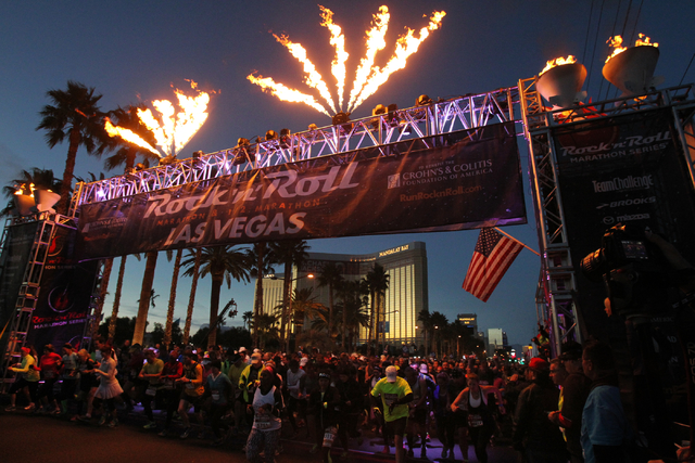 A group of runners cross the start line in the Rock 'n' Roll Las Vegas  Marathon and half marathon on the Strip on Sunday, Nov. 16, 2014. (K.M.  Cannon/Las Vegas Review-Journal) |