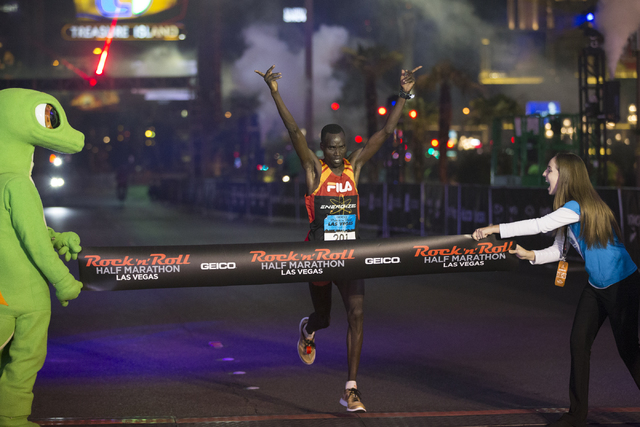 William Kibor completes the half-marathon run in first place for men during the annual Rock ‘n’ Roll Marathon at the Strip near The Mirage hotel-casino on Sunday, Nov. 13, 2016, in L ...