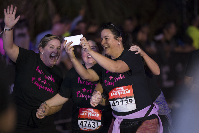 Runners complete the 10K run in the annual Rock ‘n’ Roll Marathon at the Strip near The Mirage hotel-casino on Sunday, Nov. 13, 2016, in Las Vegas. Erik Verduzco/Las Vegas Review-Jou ...