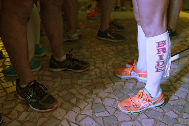 Melanie Correia's &quot;bride&quot; socks are seen as she's married to Stanley Dymbecki during the Rock 'n' Roll Marathon's  “run-thru” weddings at The Park in Las Vegas, Sun ...