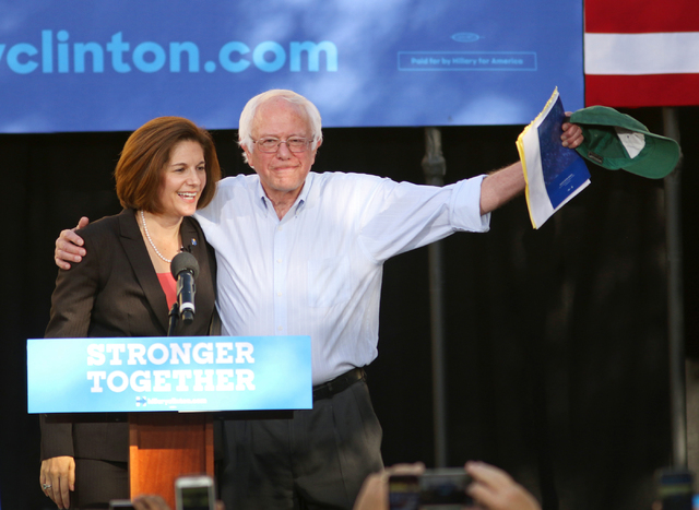 Vermont Sen. Bernie Sanders, right, embraces Nevada U.S. Senate Democratic candidate Catherine Cortez Masto at a rally at College of Southern Nevada, Sunday, Nov. 6, 2016, in North Las Vegas. Some ...