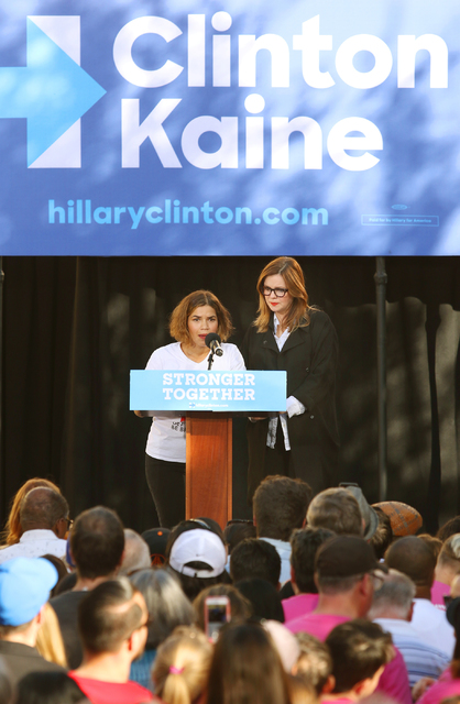 Actresses America Ferrera, left, and Amber Tamblyn take the podium at a rally at College of Southern Nevada, Sunday, Nov. 6, 2016, in North Las Vegas. Some 700 people attended the rally to support ...