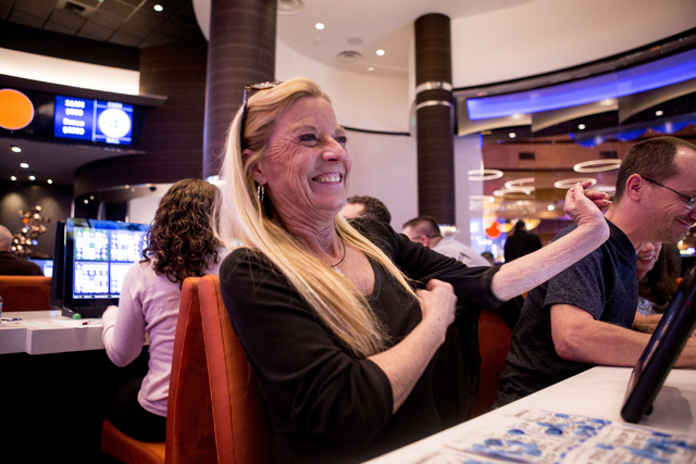 Kimberly Myers, a Station Casino employee, laughs during a bingo game in the newly refurbished bingo hall at Santa Fe Station hotel-casino, Friday, Nov. 18, 2016, in Las Vegas. Elizabeth Page Brum ...