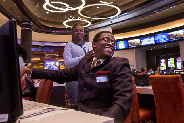 Edward Polk, a Station Casino employee, smiles after winning a game of bingo in the newly refurbished bingo hall at Santa Fe Station hotel-casino, Friday, Nov. 18, 2016, in Las Vegas. Elizabeth Pa ...