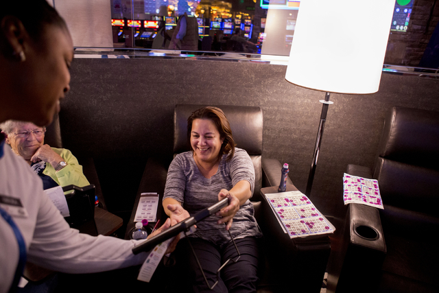 Nolla Eustis, a Station Casino employee, sits in a reclining chair in the VIP section of the newly refurbished bingo hall at Santa Fe Station hotel-casino, Friday, Nov. 18, 2016, in Las Vegas. Eli ...