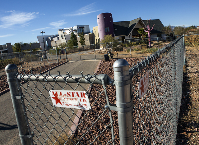 A secured fence surrounds The Slammer, the former home of magician Penn Jillette, in southwest Las Vegas, on Tuesday, Nov. 15, 2016. American West Homes bought the mansion and is schedule to demol ...
