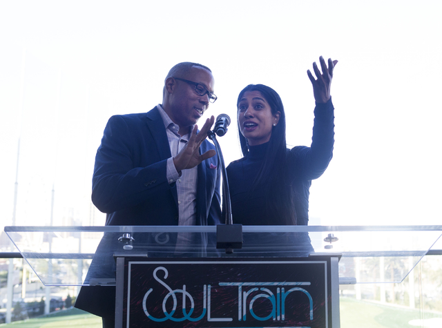 ESPN host Jay Harris, left, and Seema Sadekar, professional golfer, speak at Topgolf Las Vegas for the "Soul Lunch & Greens," a benefit for the Don Cornelius Foundation Friday, Nov. 4, 2016. E ...