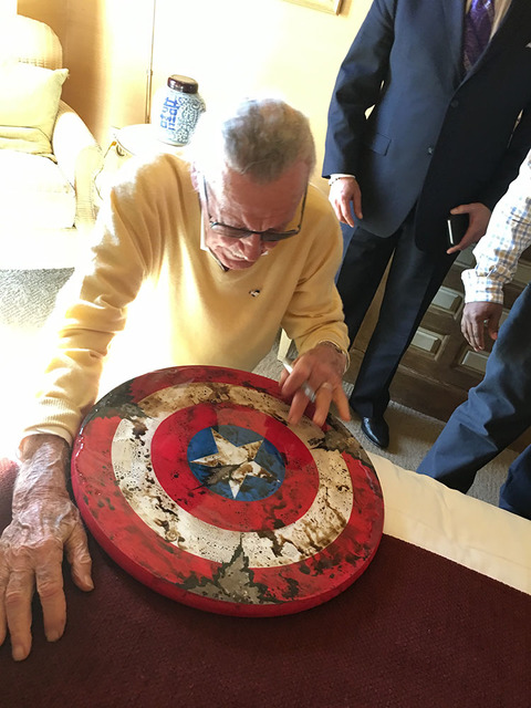 Marvel Comics founder Stan Lee is shown signing a Captain America shield during an appearance at Treasure Island's Marvel Avengers S.T.A.T.I.O.N. on Friday, Nov. 18, 2016. (John Katsilometes/Las V ...