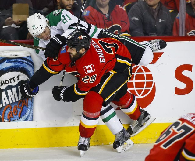 Dallas Stars Antoine Roussel left from France is checked by