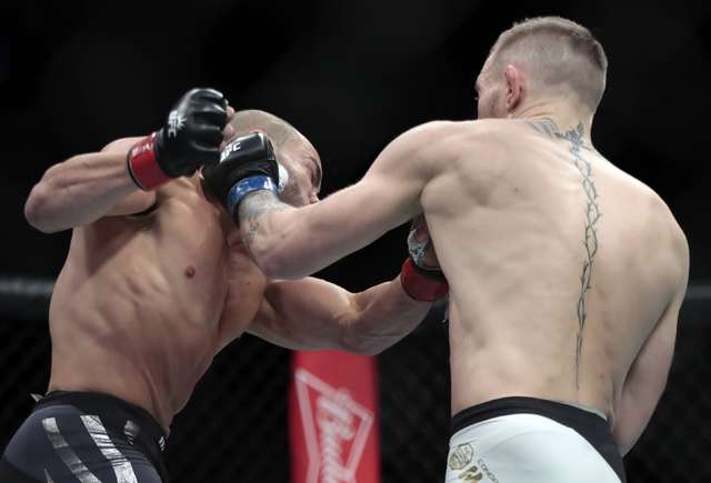 McGregor KOs Alvarez to take second title at UFC 205 