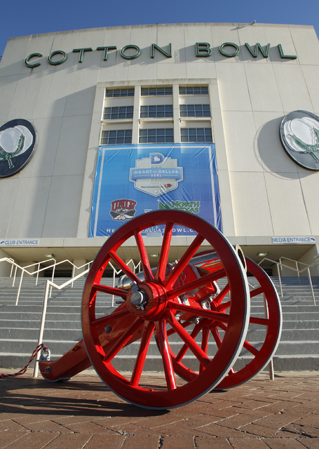 The Fremont Cannon sits in front of the Cotton Bowl in Dallas before UNLV gets it's team photo taken Tuesday, Dec. 31, 2013. UNLV will play North Texas in the Heart of Dallas Bowl on Wednesday. (J ...