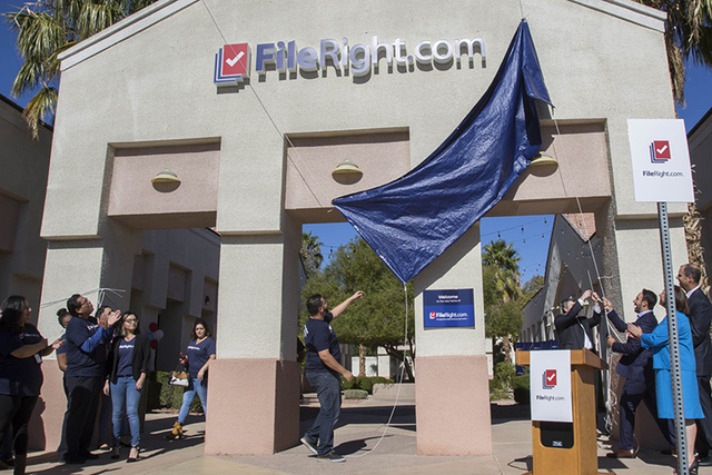 FileRight.com employees and other dignitaries unveil the company's new marquee during the grand opening of FileRight's Henderson office on Monday, Nov. 14, 2016. (Richard Brian/Las Vegas Review-Jo ...