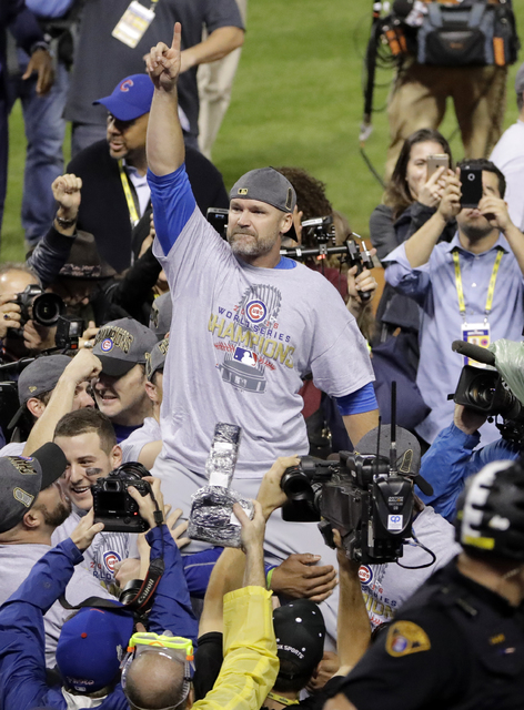 Chicago Cubs' David Ross is carried by teammates after Game 7 of the Major  League Baseball World Series against the Cleveland Indians Thursday, Nov.  3, 2016, in Cleveland. The Cubs won 8-7